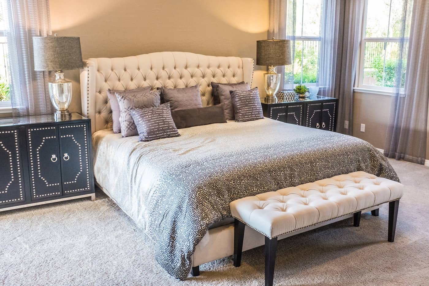 Bright, calm master bedroom with a neatly made bed